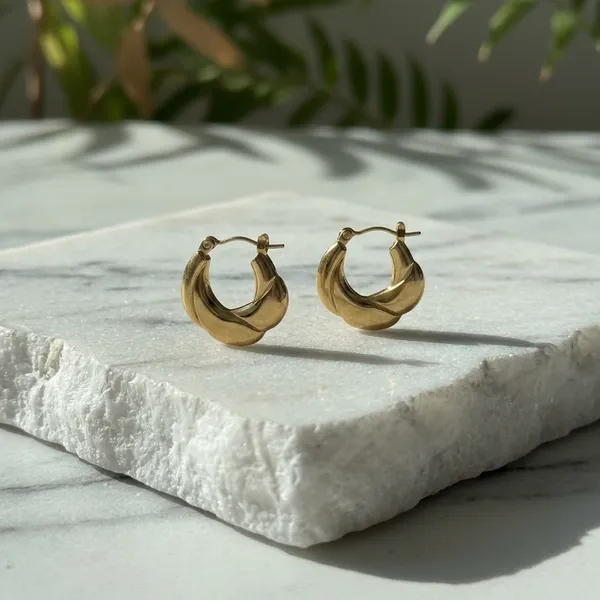 Elegant_Twisted_Gold_Hoop_Earrings