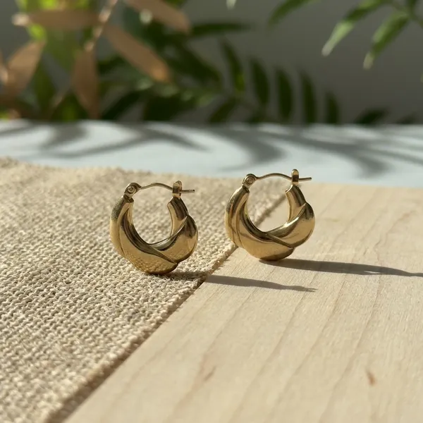 Elegant_Twisted_Gold_Hoop_Earrings
