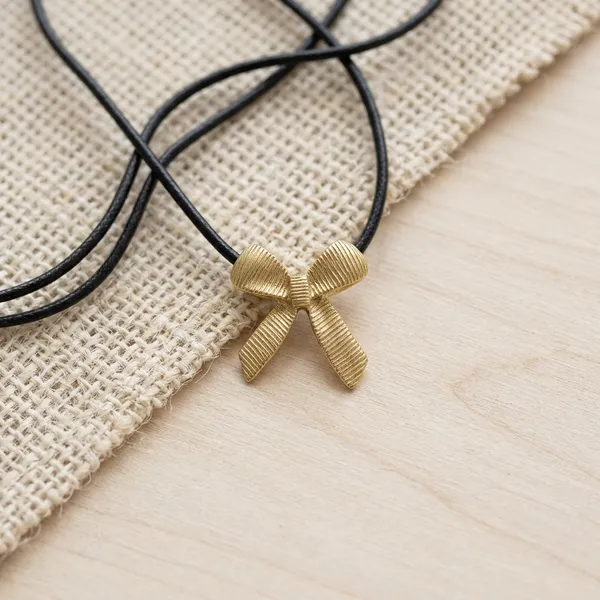Golden_Textured_Bow_Pendant_Cord_Chain