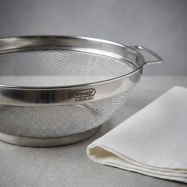 Stainless_Steel_Puran_Jali_For_Washing_Rice_Fruits_Vegetables_And_Grains_Dia_23Cm
