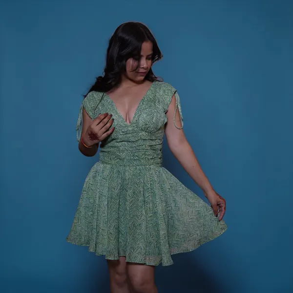 Green_Printed_Fit_And_Flare_Dress_With_Ruffle_Sleeves_And_Back_Tie-Up_Detail