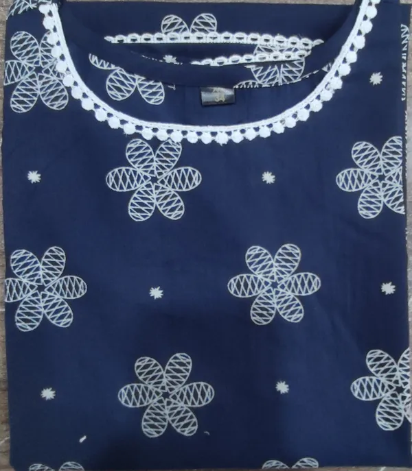 Navy_Blue_Embroidered_Kurti_With_White_Floral_Pattern_And_Pom_Pom_Detailing