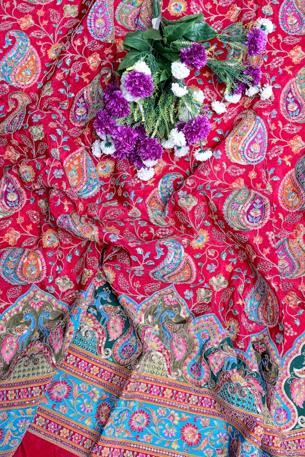 Natural_Crepe_Rani_Pink_Paisley_Floral_Placement_Print_Fabric_With_Ornamental_Border