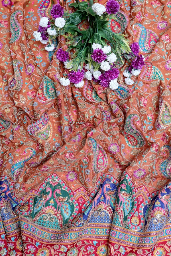 Natural_Crepe_Camel_Brown_Paisley_Floral_Placement_Print_Fabric_With_Peacock_Ornamental_Border