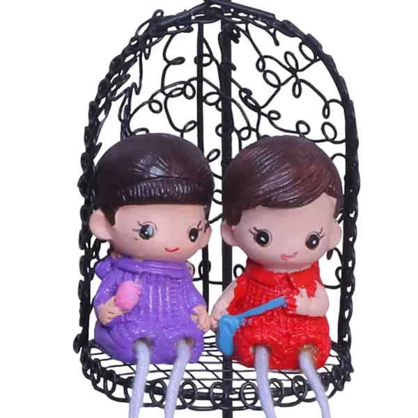 Decorative_Hanging_Birdcage_With_Couple_Dolls_Black_Metal_Cage_With_Purple_And_Red_Figurines