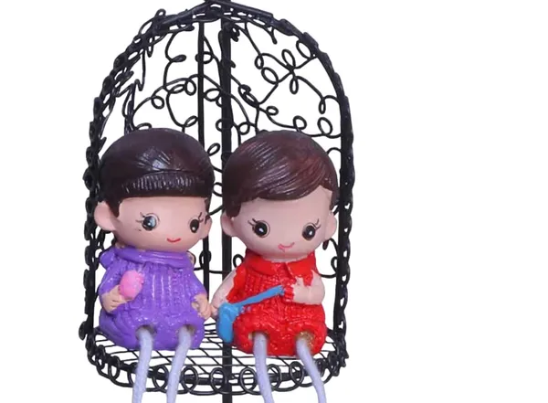 Decorative_Hanging_Birdcage_With_Couple_Dolls_Black_Metal_Cage_With_Purple_And_Red_Figurines