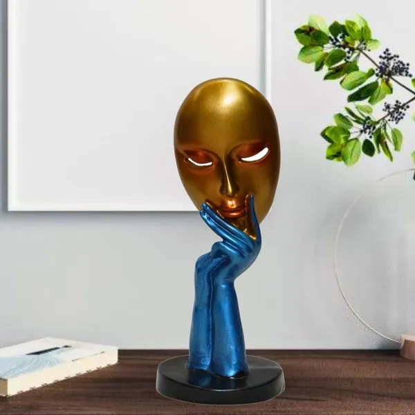 Decorative_Golden_Mask_With_Blue_Hand_Sculpture_On_Black_Base