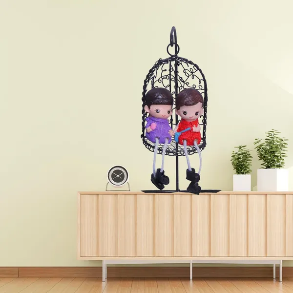 Decorative_Hanging_Birdcage_With_Couple_Dolls_Black_Metal_Cage_With_Purple_And_Red_Figurines