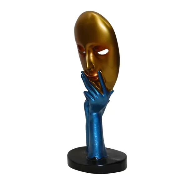 Decorative_Golden_Mask_With_Blue_Hand_Sculpture_On_Black_Base