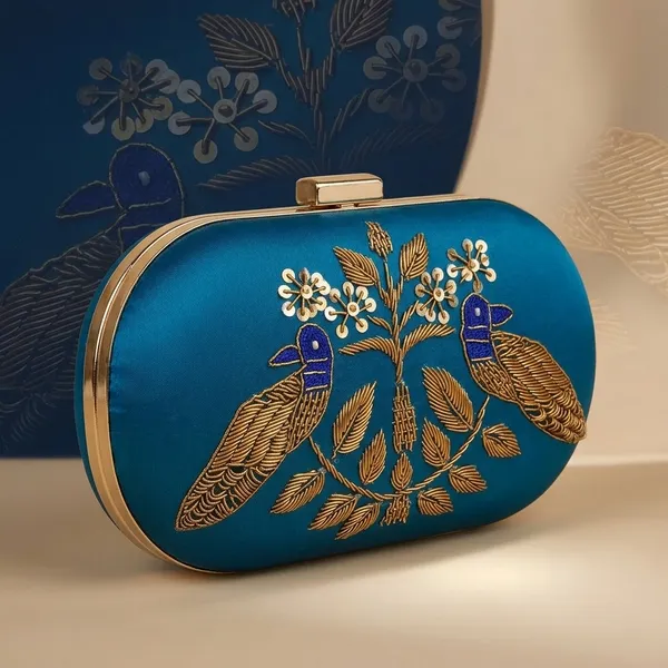 Blue_Silk_Base_And_Metal_Frame_And_Zardosi_Work_Embroidered_Bag_For_Women