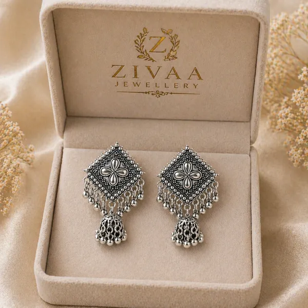 Silver_Toned_Brass_Jhumka_Earrings_With_Floral_Design_And_Tassel_Drops