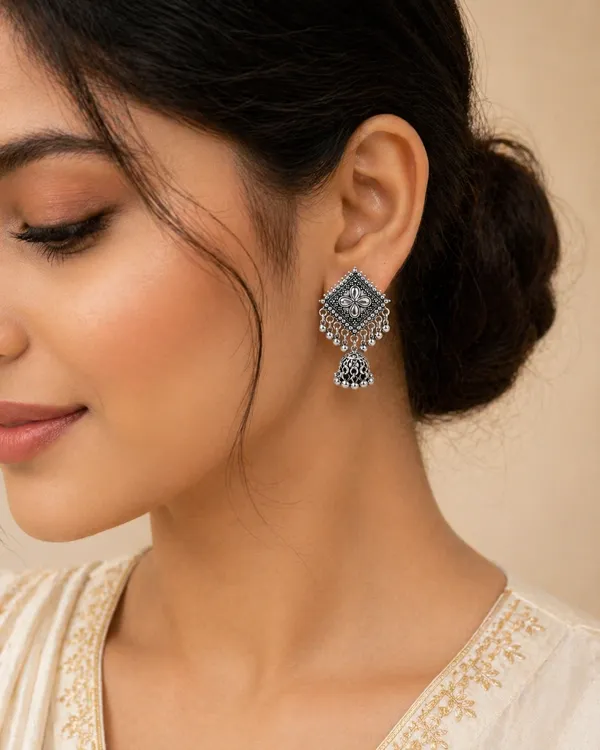 Silver_Toned_Brass_Jhumka_Earrings_With_Floral_Design_And_Tassel_Drops