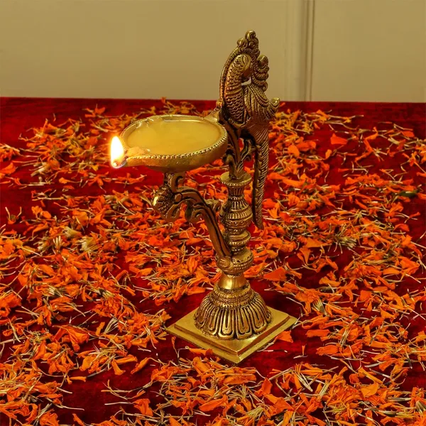 Brass_Carved_Peacock_Diya_Stand_Ethnic_Design_Handmade_Curved_Oil_Wick_Antique_Deepam_Lamp_For_Home_Decor_Temple_Puja_Office_Diwali_Decoration_Festival_Gift_8_Inches_And_650G_Golden