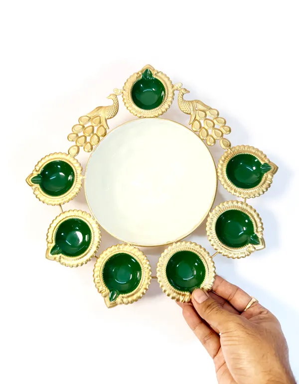 Peacock_Diya_7_Tealight_Holder_with_Urli_Center,_Glossy_Painted_Green,_Gold,,for_Diwali_and_home_décor