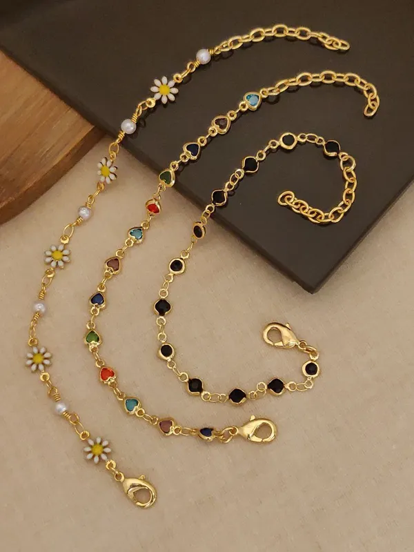 Set_of_3_Gold-Tone_Chain_Bracelets_with_Daisy,_Multicolor_Stones,_and_Black_Stones