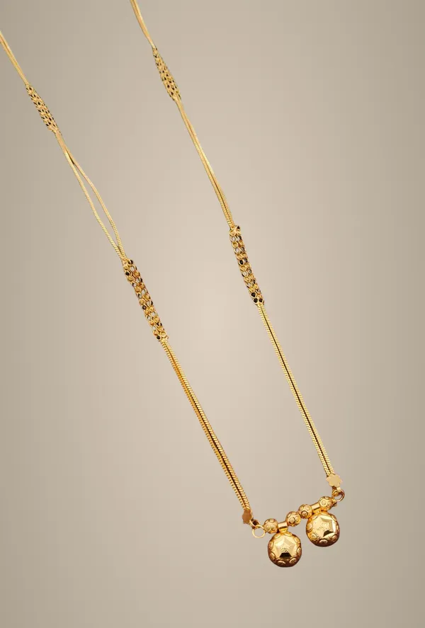 Elegant_Gold-Toned_Layered_Chain_Necklace_with_Dual_Sphere_Pendants