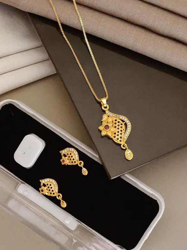 Stylish_Gold_Plated_Swirl_Round_Pendant_Set_For_Women_Cz_Ruby_Stone_Studded_Designer_Chain_Necklace_With_Matching_Drop_Earrings_Party_Festive_Wear_Jewellery
