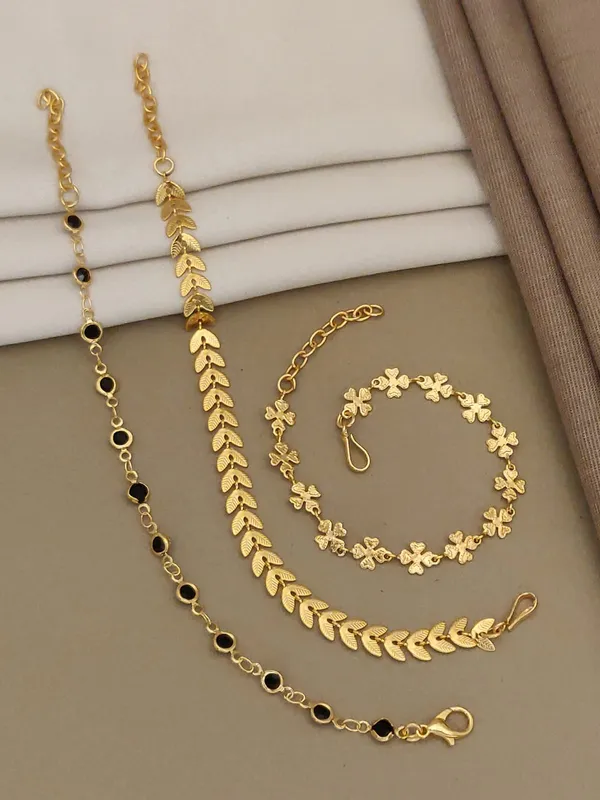Set_of_3_Gold-Toned_Decorative_Bracelets_with_Black_Accents,_Leaf_Design,_and_Floral_Motifs