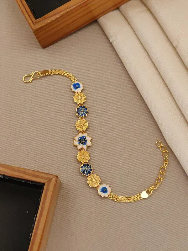 Elegant_Floral_Bracelet_with_Blue_and_Gold_Flower_Charms