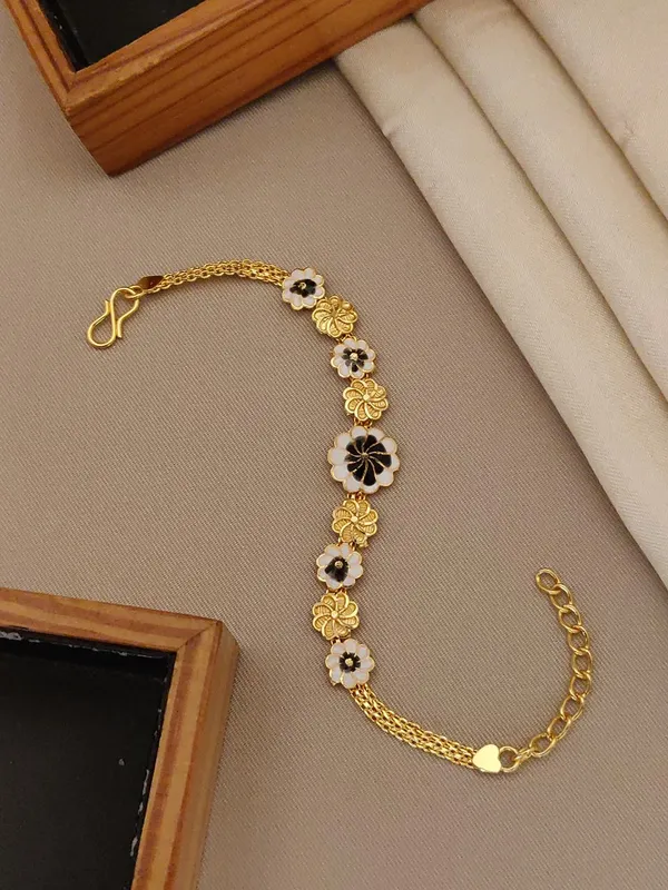 Golden_Floral_Enamel_Bracelet_with_Black_and_White_Flower_Charms