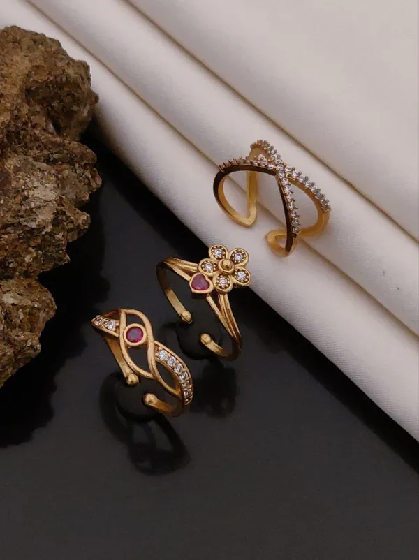 Elegant_Gold-Toned_Designer_Ring_Set_with_Floral_&_Geometric_Patterns