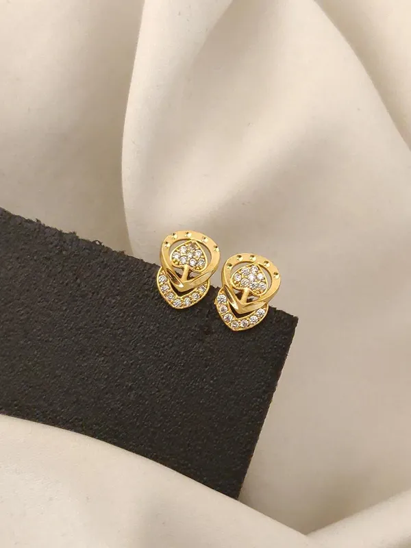 Golden_Floral_Twist_Stud_Earrings_with_Crystal_Accents