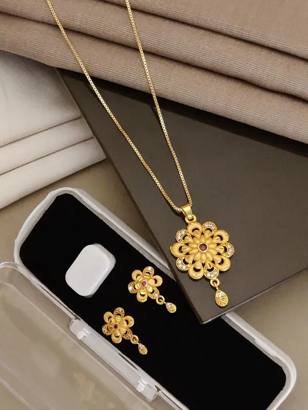 Elegant_Gold_Plated_Floral_Round_Pendant_Set_For_Women_Cz_Ruby_Stone_Studded_Designer_Chain_With_Matching_Drop_Earrings_Wedding_Festive_Wear_Jewellery