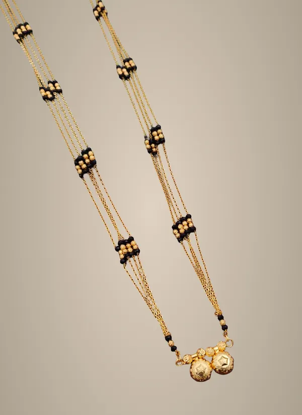 Traditional_Gold-Toned_Mangalsutra_Chain_with_Black_Beads_and_Pendant