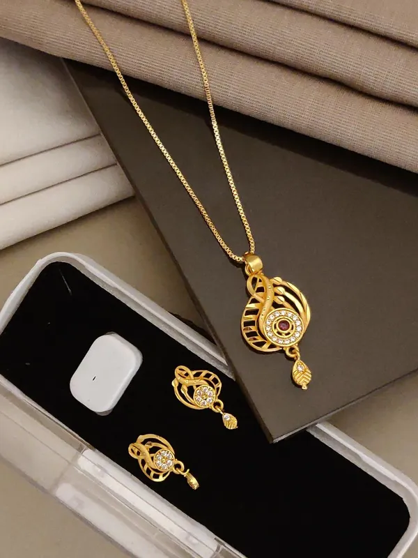Stylish_Gold_Plated_Swirl_Round_Pendant_Set_For_Women_Cz_Ruby_Stone_Studded_Designer_Chain_Necklace_With_Matching_Drop_Earrings_Party_Festive_Wear_Jewellery