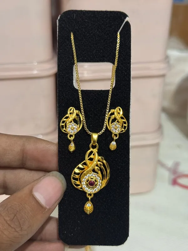Stylish_Gold_Plated_Swirl_Round_Pendant_Set_For_Women_Cz_Ruby_Stone_Studded_Designer_Chain_Necklace_With_Matching_Drop_Earrings_Party_Festive_Wear_Jewellery