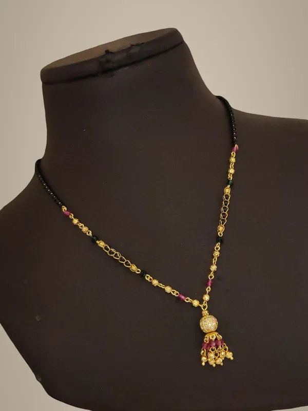 Elegant_Black_Beaded_Mangalsutra_with_Golden_Pendant