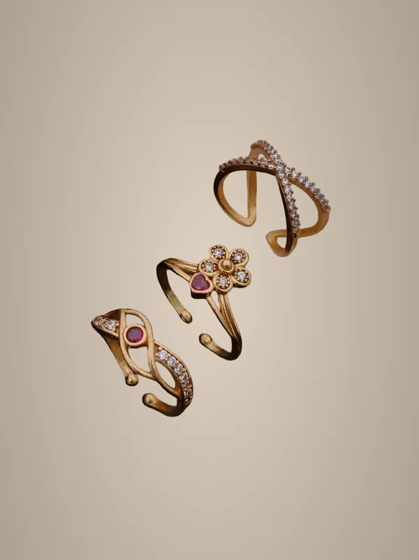 Elegant_Gold-Toned_Designer_Ring_Set_with_Floral_&_Geometric_Patterns