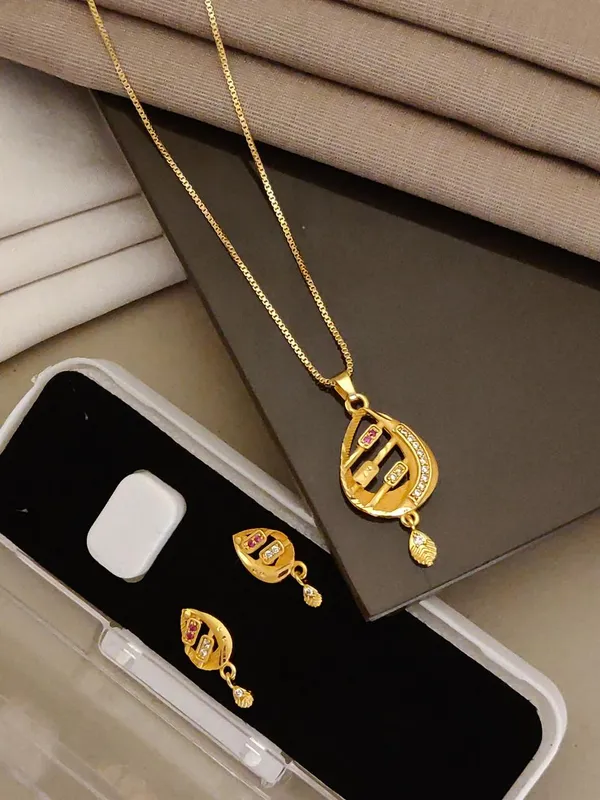 Premium_Gold_Plated_Floral_Bell_Pendant_Set_For_Women_Cz_Ruby_Stone_Studded_Chain_Necklace_With_Matching_Drop_Earrings_Traditional_Party_Wear_Jewellery