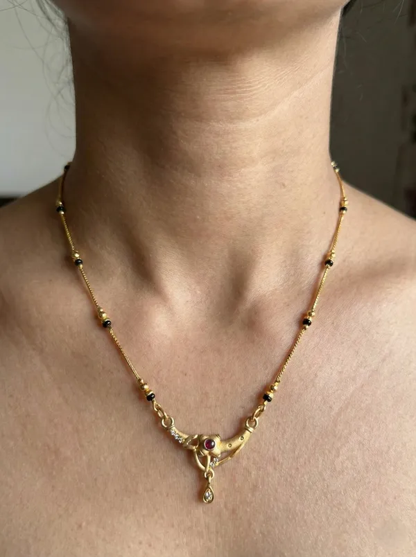 Stylish_Gold_Plated_Mangalsutra_For_Women_Curved_Pendant_Design_Simple_Black_Beads_Necklace