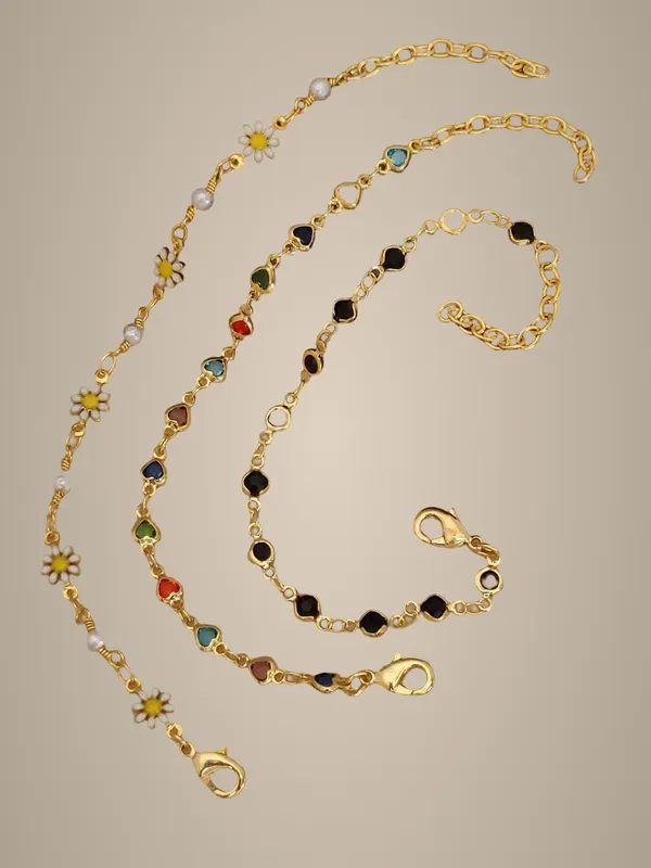 Set_of_3_Gold-Tone_Chain_Bracelets_with_Daisy,_Multicolor_Stones,_and_Black_Stones