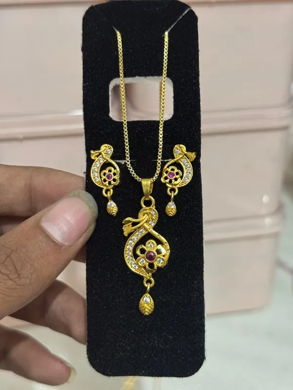 Elegant_Gold_Plated_Floral_Round_Pendant_Set_For_Women_Cz_Ruby_Stone_Studded_Designer_Chain_With_Matching_Drop_Earrings_Wedding_Festive_Wear_Jewellery