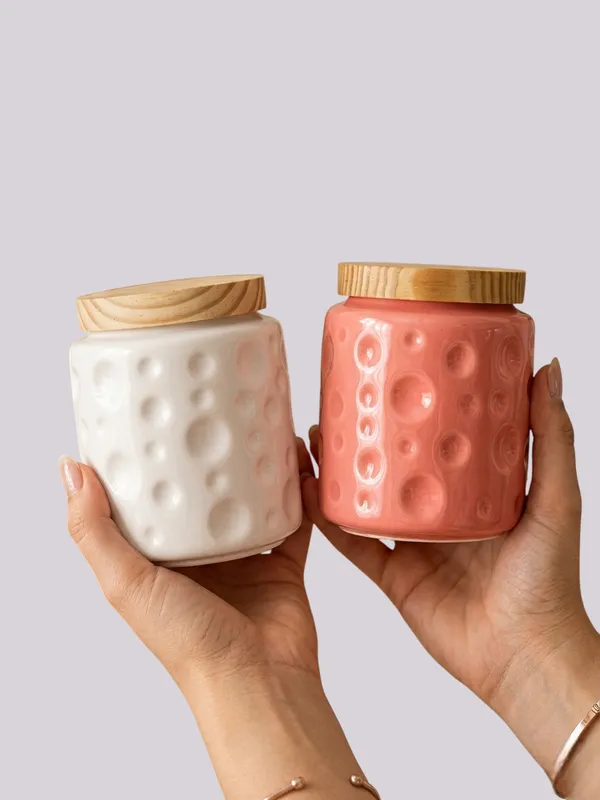 Textured_Ceramic_Jar_Set_With_Wooden_Lids_-_Set_Of_2_(White_&_Pink)