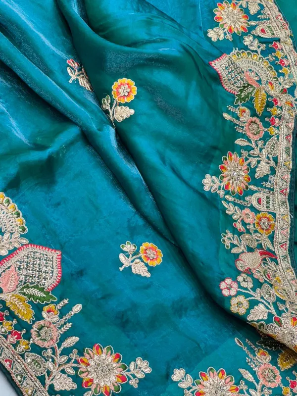 Turquoise_Silk_Saree_With_Intricate_Floral_Embroidery_And_Zari_Work