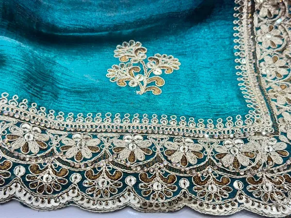 Teal_Green_Velvet_Saree_With_Golden_Embroidered_Border_And_Floral_Motifs