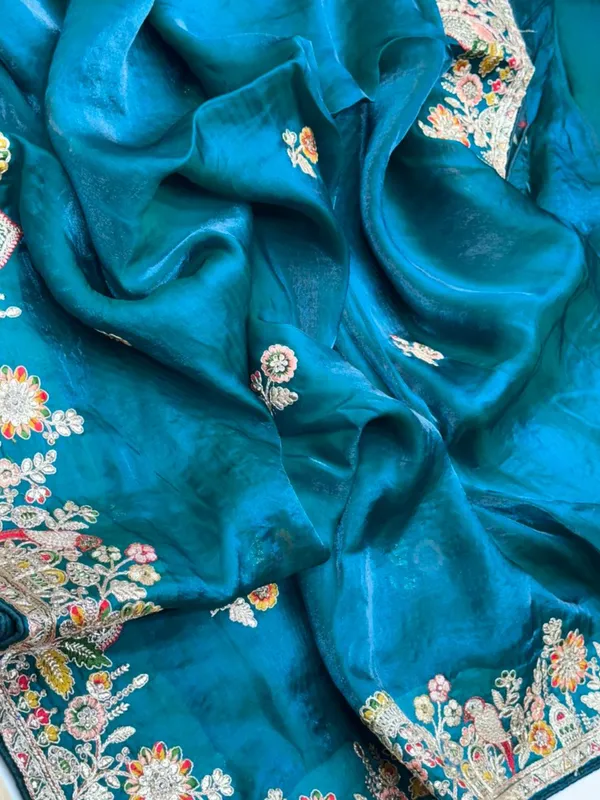 Turquoise_Silk_Saree_With_Intricate_Floral_Embroidery_And_Zari_Work