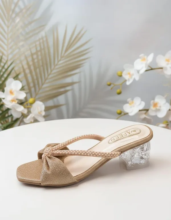 Effortless_Glamour_With_These_Stunning_Mule_Heels_Designed_To_Add_A_Touch_Of_Sparkle_To_Every_Outfit_Featuring_A_Chic_Open_Toe_Silhouette_And_A_Beautifully_Crafted_Bow_Detail_These_Sandals_Are_Perfect_For_Both_Festive_Occasions_And_Evening_Outings