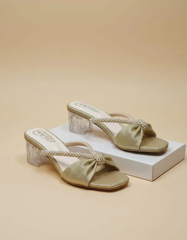 Effortless_Glamour_With_These_Stunning_Mule_Heels_Designed_To_Add_A_Touch_Of_Sparkle_To_Every_Outfit_Featuring_A_Chic_Open_Toe_Silhouette_And_A_Beautifully_Crafted_Bow_Detail_These_Sandals_Are_Perfect_For_Both_Festive_Occasions_And_Evening_Outings