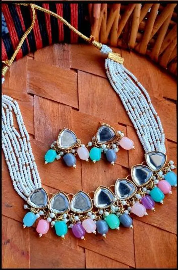 Multi-Strand_White_Bead_Necklace_With_Grey_Stone_Pendant_And_Colourful_Bead_Tassels