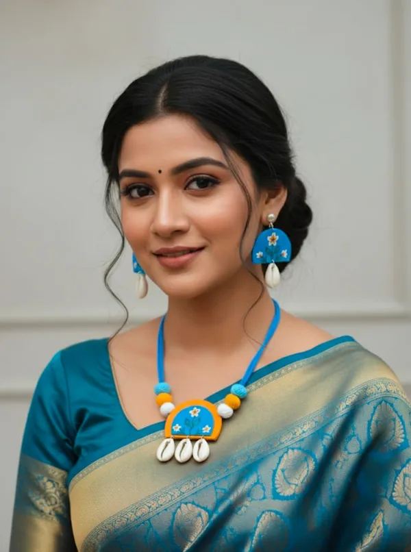 Handcrafted_Blue_Terracotta_Necklace_And_Earring_Set_With_Floral_Design_And_Cowrie_Shell_Drops