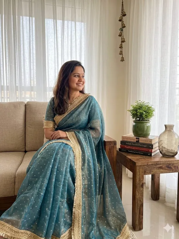 Women'S_Teal_Blue_Saree_With_Gold_Border_And_Embellishments