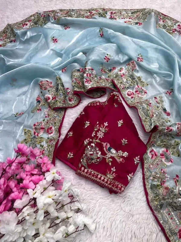 Sky_Blue_Embroidered_Organza_Saree_With_Floral_Border_And_Red_Blouse