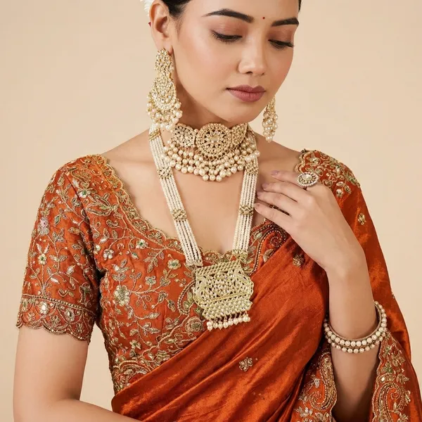 Traditional_Red_Silk_Saree_With_Embroidered_Blouse_And_Gold_Jewelry_Set