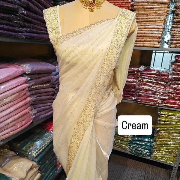 Elegant_Cream_Saree_With_Golden_Pearl_Border_And_Embellished_Blouse
