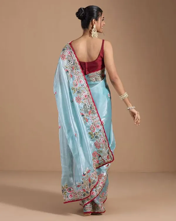 Sky_Blue_Embroidered_Organza_Saree_With_Floral_Border_And_Red_Blouse