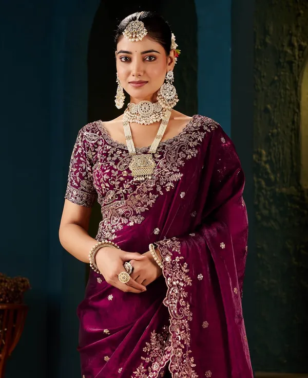 Pink_Embroidered_Silk_Saree_With_Heavy_Blouse_And_Pearl_Necklace